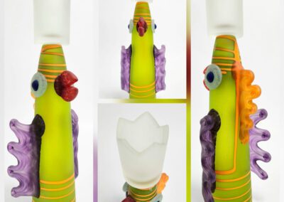Colorful glass sculpture with abstract bird design.
