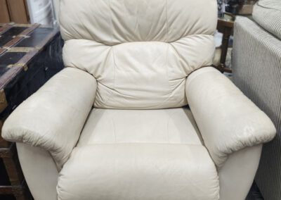 Beige leather armchair in a furniture store.