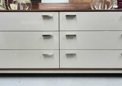 Modern six-drawer beige and brown dresser.