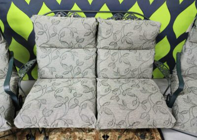 Patterned outdoor bench with green background.