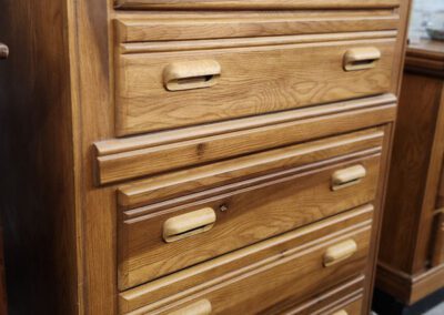 Wooden dresser with four drawers.