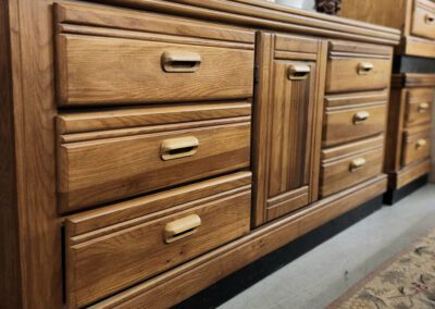 Wooden cabinet with drawers and decorative items.