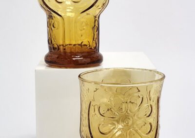 Two amber glasses with floral pattern.