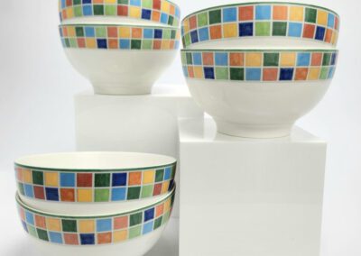 Colorful mosaic-patterned bowls stacked on display.