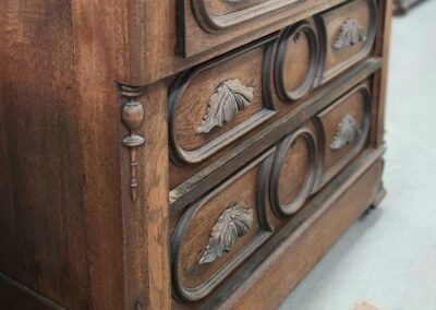 Antique wooden dresser with carved details.