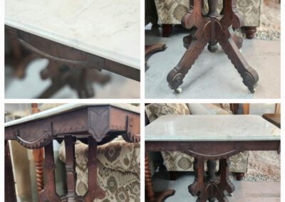 Antique wooden table with marble top.