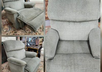 Gray recliner chair with extended footrest.