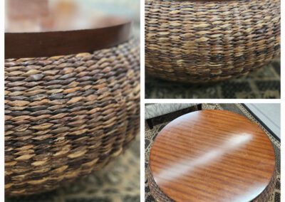 Round wicker coffee table with wooden top.