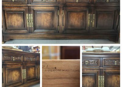 Dark wooden cabinet with decorative carvings.
