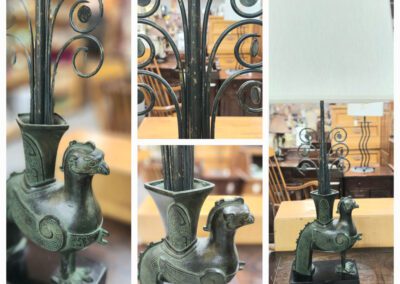 Decorative lamp with intricate animal design.