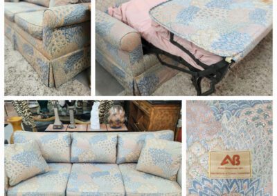 Patterned sofa bed with floral design upholstery.