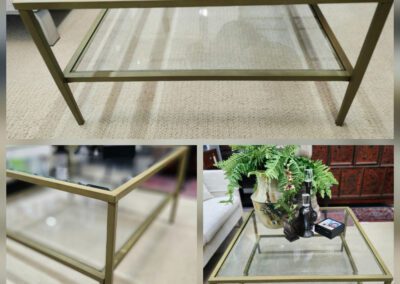 Glass coffee table with metal frame.