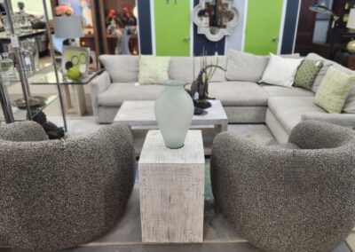 Modern living room furniture display with vase.