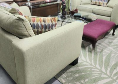 Living room with sofas and decorative cushions.