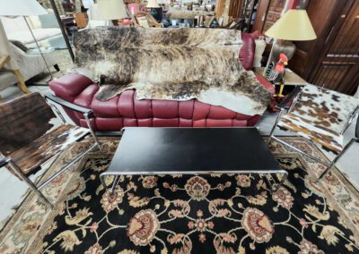 Cowhide decor in a vintage living room.