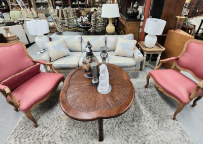 Vintage furniture set with pink chairs.