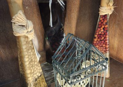 Decorative bottles and small wire cage display.