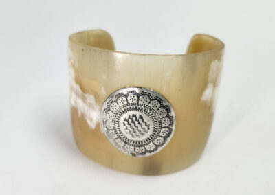 Horn cuff bracelet with silver decorative medallion