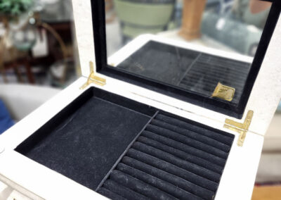 Open white jewelry box with mirror