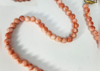 Pink coral beaded necklace with gold clasp