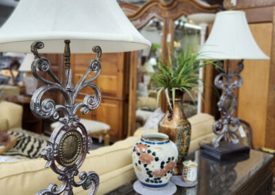 Pair of ornate metal table lamps on console