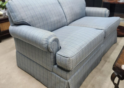 Light blue plaid loveseat with rolled arms