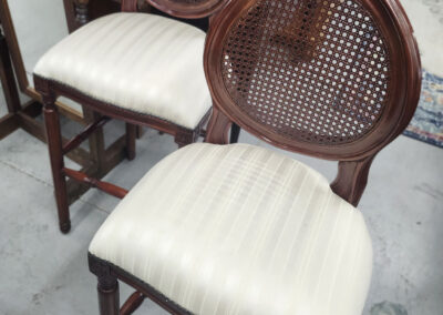 Pair of vintage cane-back wooden chairs