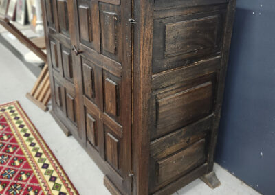 Antique dark wood paneled sideboard cabinet