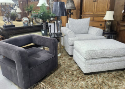 Gray and patterned armchairs with ottoman