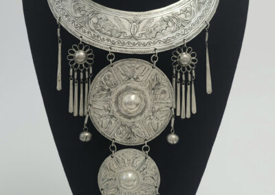Ornate silver tribal statement necklace on bust