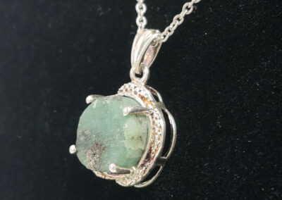 Green raw stone pendant on silver chain