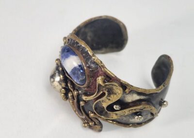Antique brass cuff bracelet with blue stone