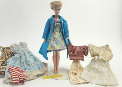 Vintage fashion doll wearing blue coat