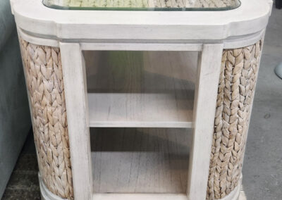 Whitewashed wicker side table with glass top