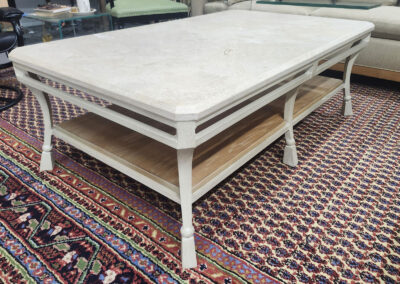 White marble-top coffee table with lower shelf