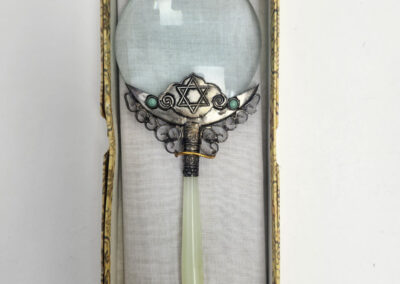 Ornate magnifying glass featuring Star of David