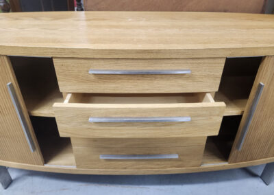 Light wood media console with open center drawer
