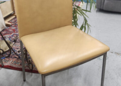 Tan leather dining chair with metal legs