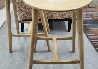 Pair of wooden stools with triangular seats