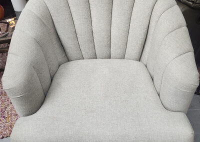 light gray scalloped shell-back accent chair