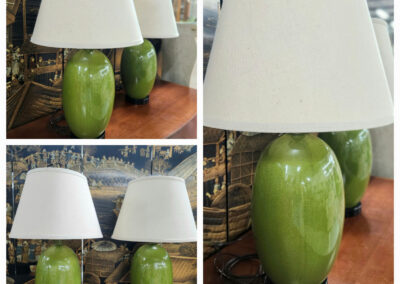 Pair of green ceramic lamps with white shades