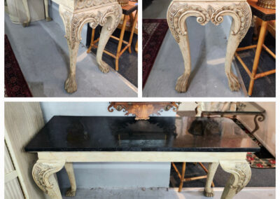 Antique carved console table with black marble top