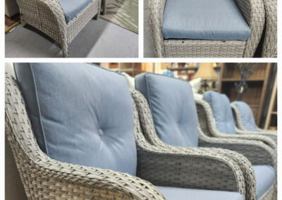 Three gray wicker chairs with blue cushions