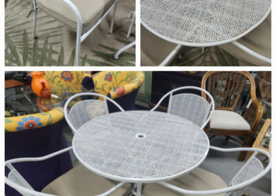 White metal patio table with four chairs