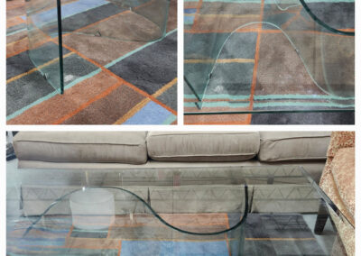 Curved glass coffee table on patterned rug