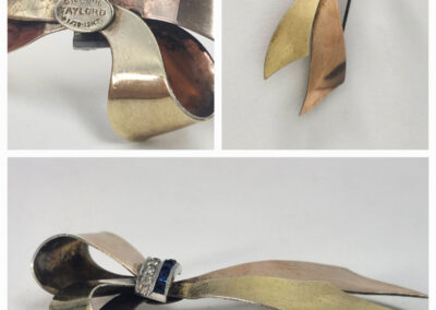 Vintage mixed-metal bow brooch with blue stones