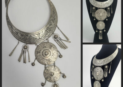 Ornate silver tribal bib necklace with medallions