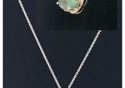 Silver necklace with green gemstone pendant