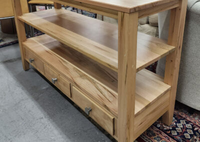 Wooden console table with shelves and drawers