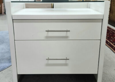White two-drawer nightstand with metal handles